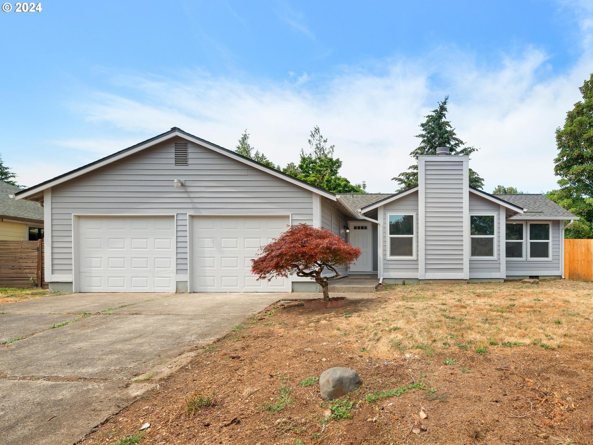 front view of a house with a yard