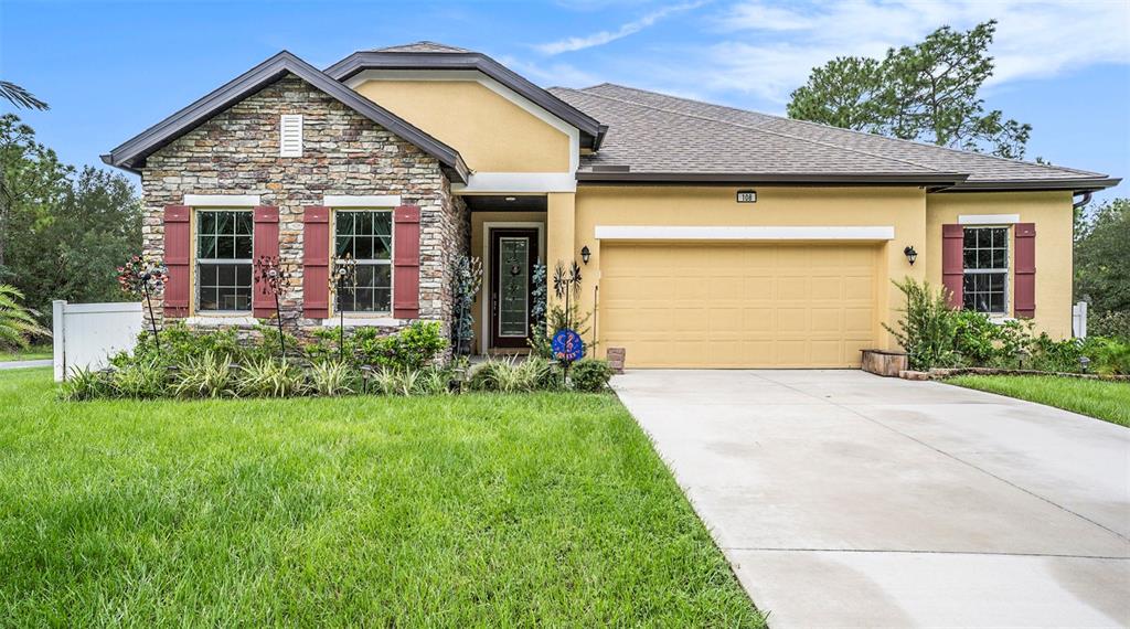 front view of a house with a yard