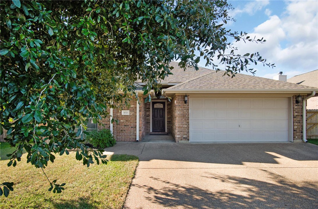 View of front facade featuring a garage