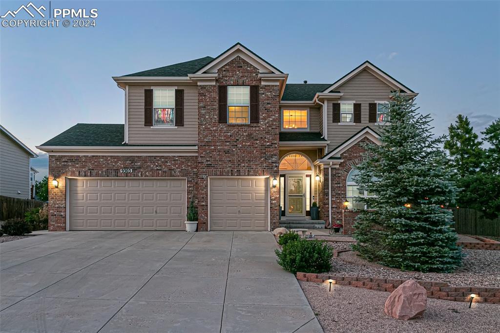 View of front of property with a garage