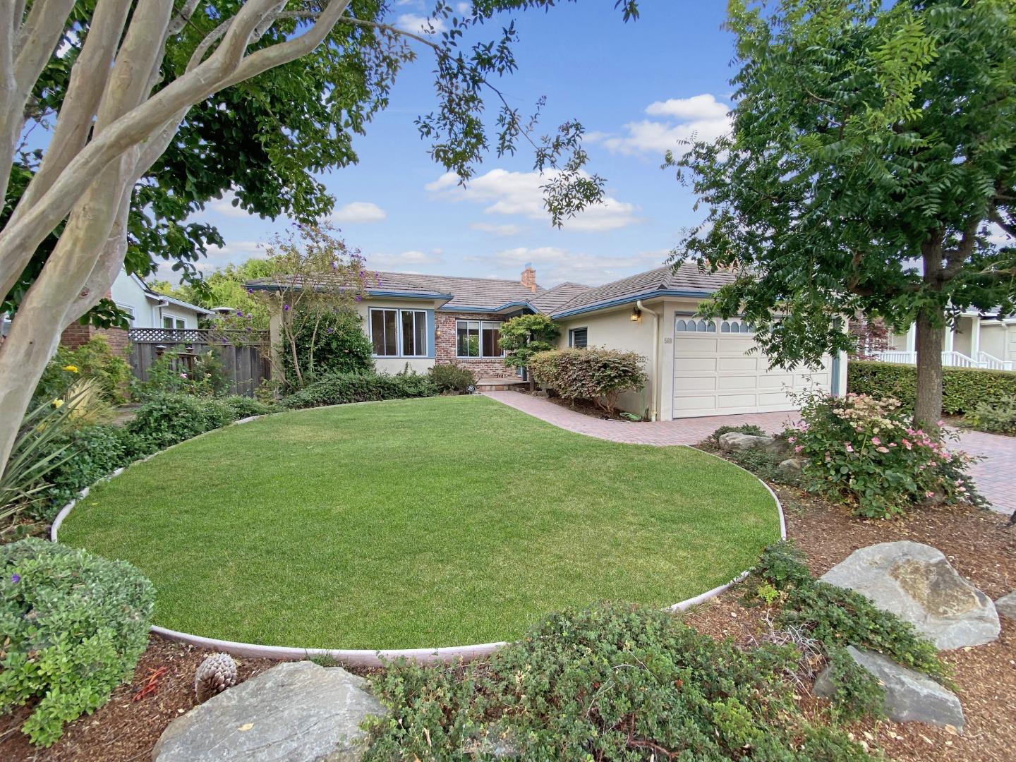 front view of a house with a garden