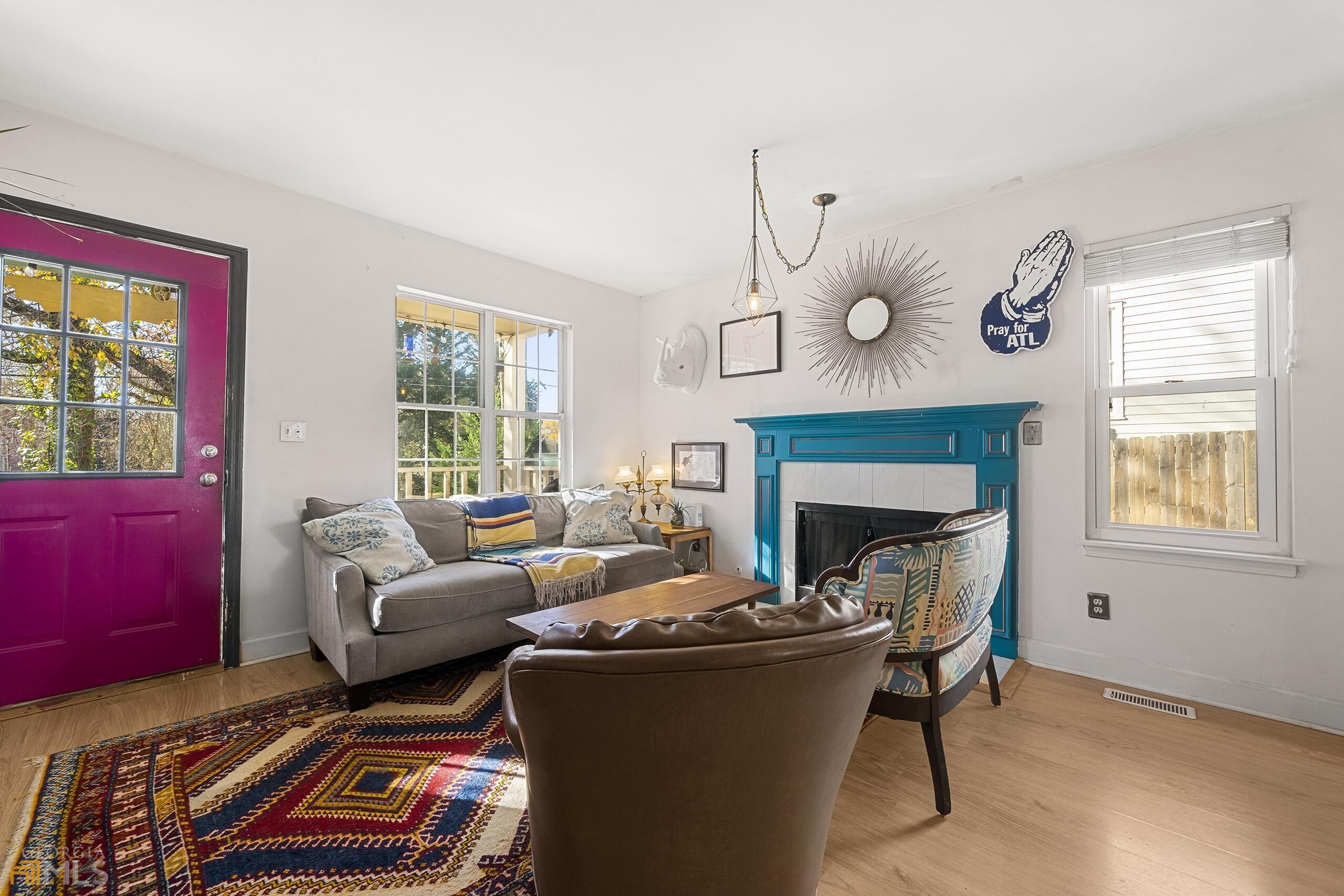 a living room with furniture and a fireplace