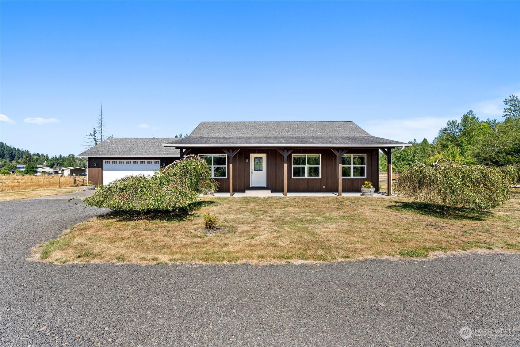 a front view of a house with a yard