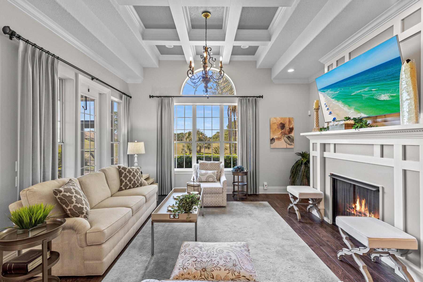 a living room with furniture a fireplace and a flat screen tv