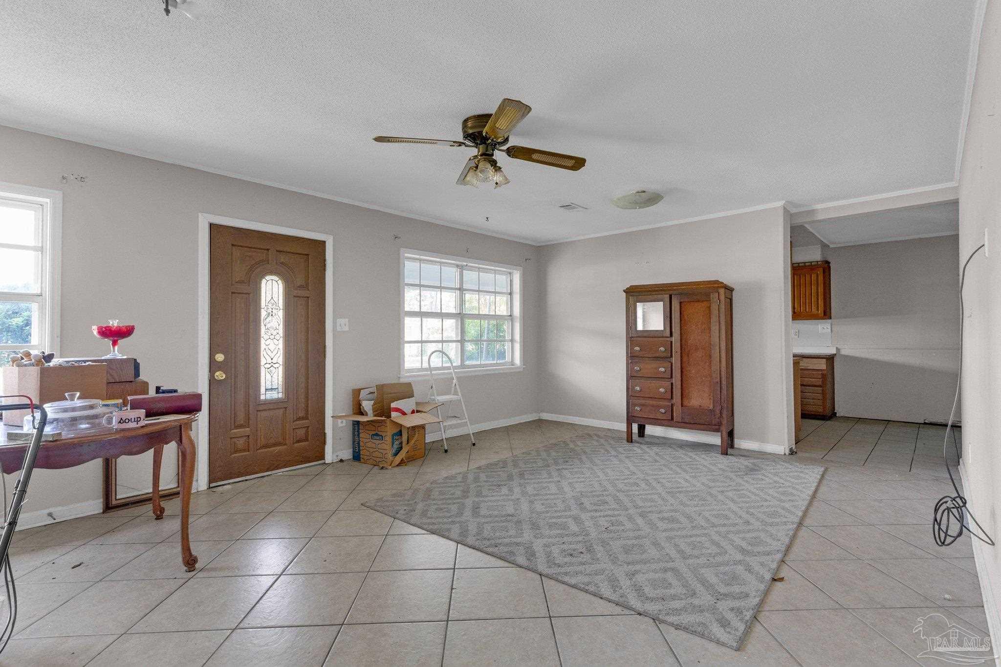 a living room with furniture and a window