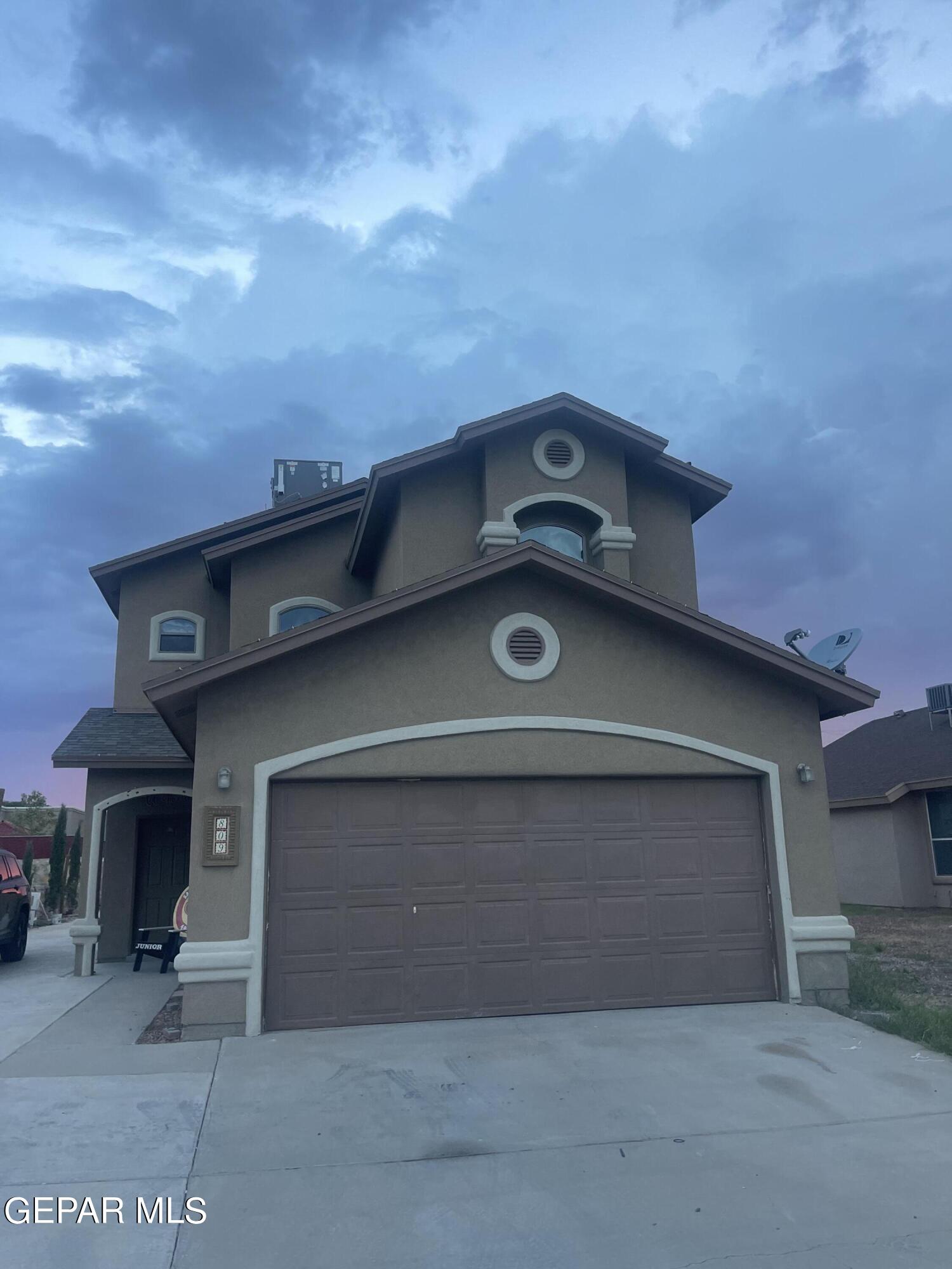 a front view of a house with yard