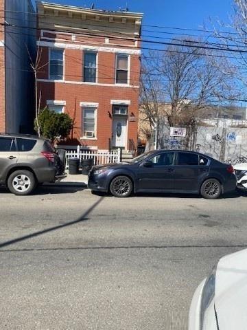 a view of a car parked in front of a building