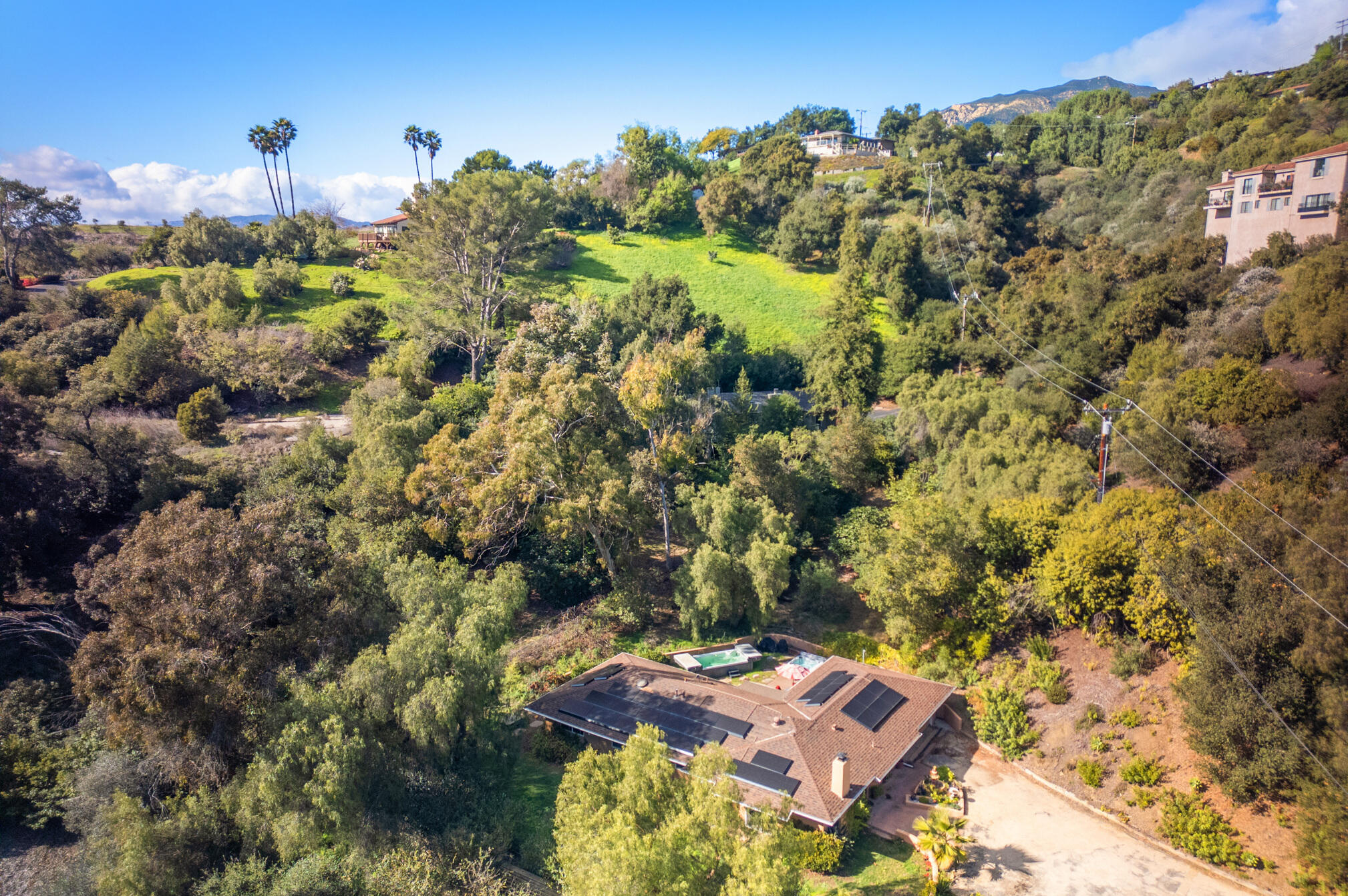 an aerial view of a house with a yard