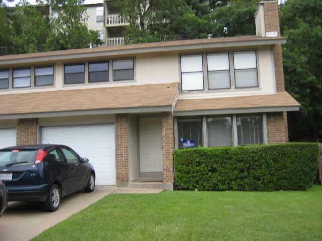 a house view with a garden space