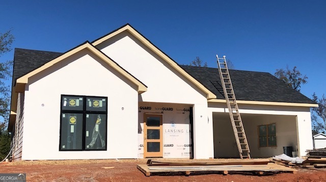 a front view of a house with garage