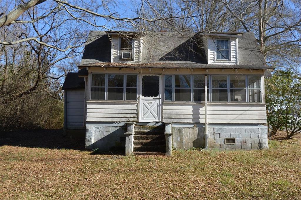 a front view of a house with garage