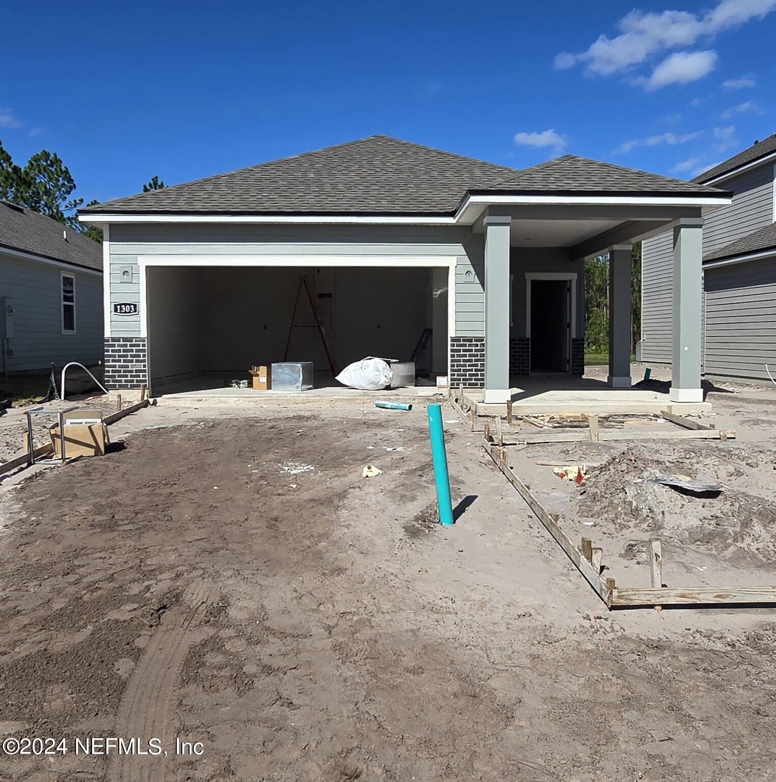 a house with yard in front of it