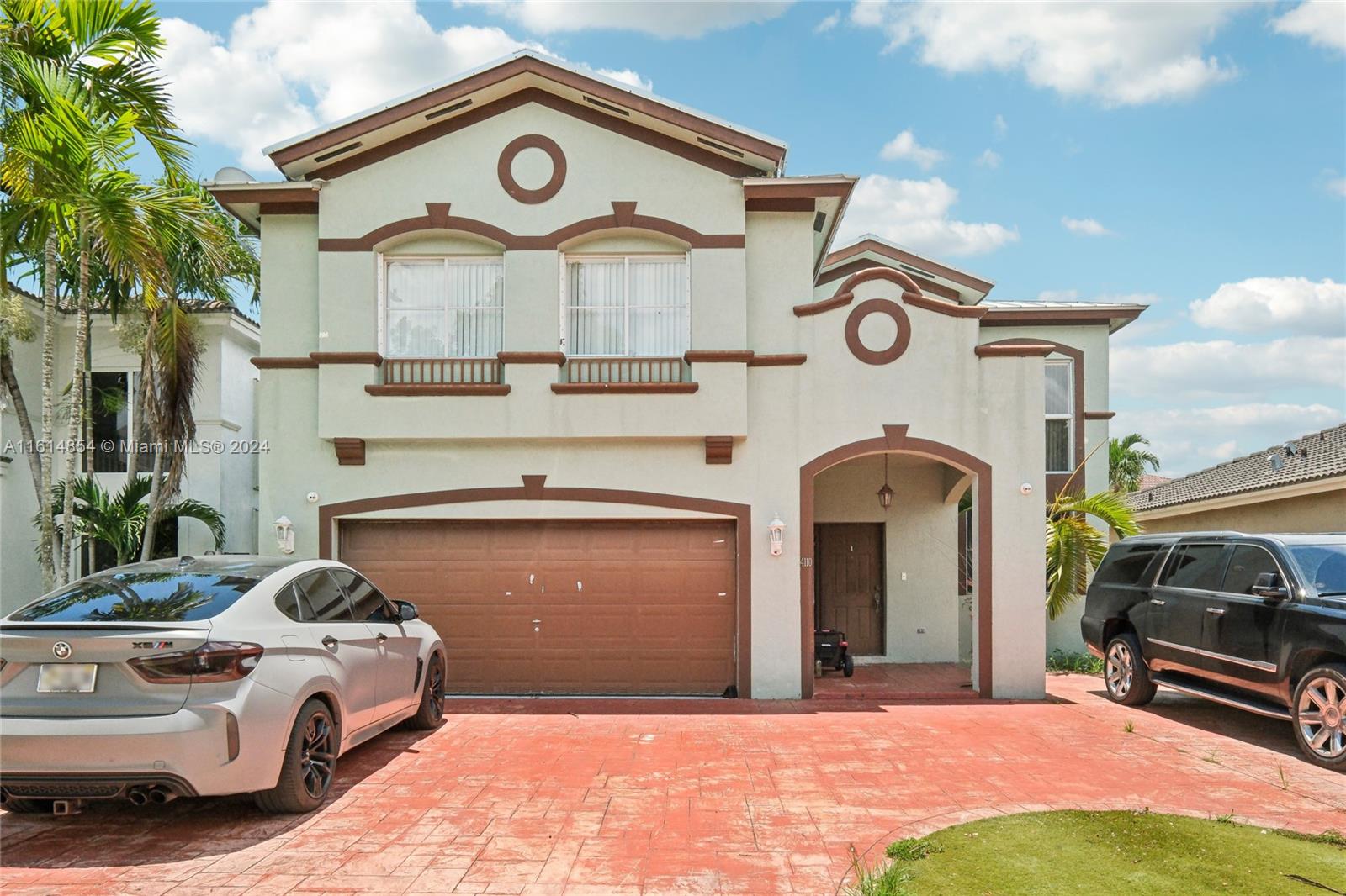 a front view of a house with parking space