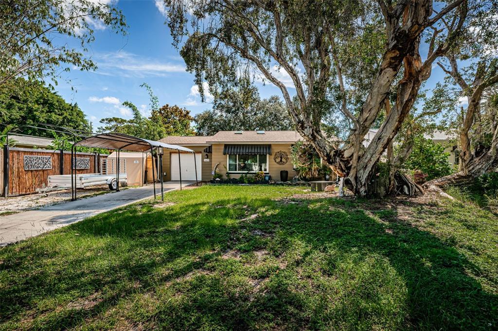 a view of house with a yard