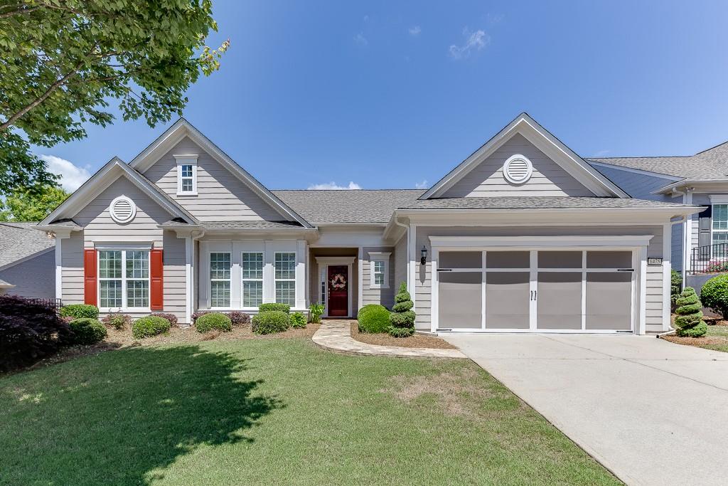 front view of a house with a yard