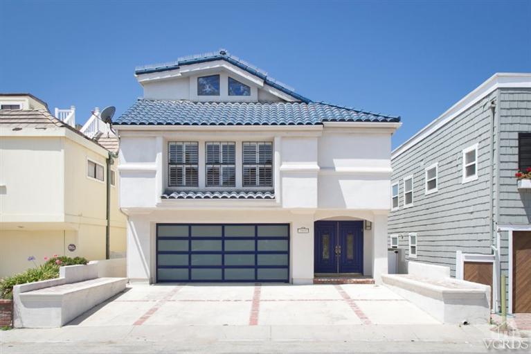 a front view of a house with a garage