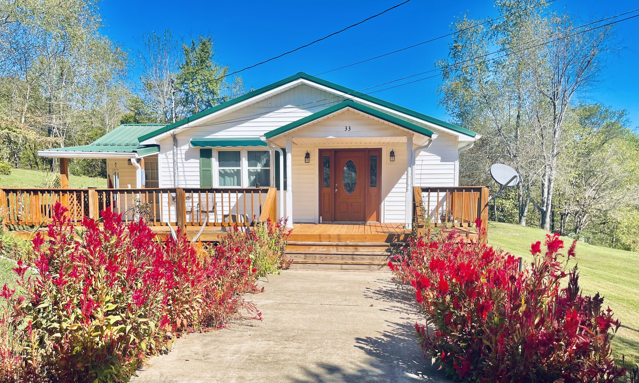 a front view of a house with a yard