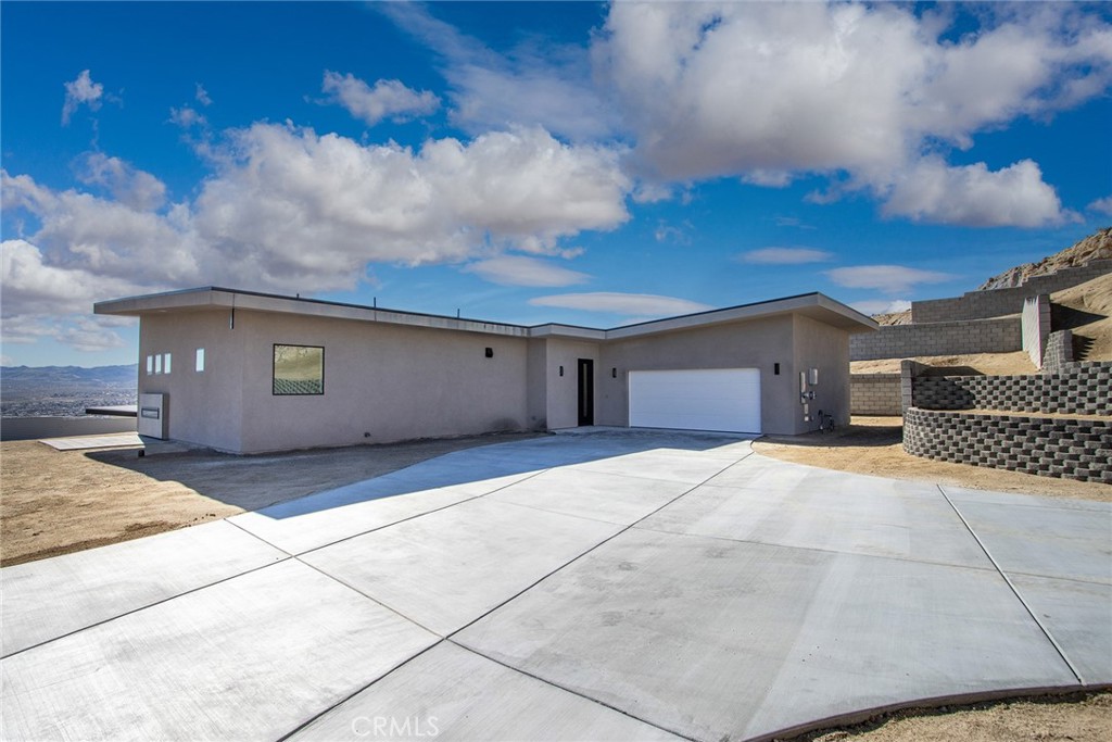 a front view of a house with a garage