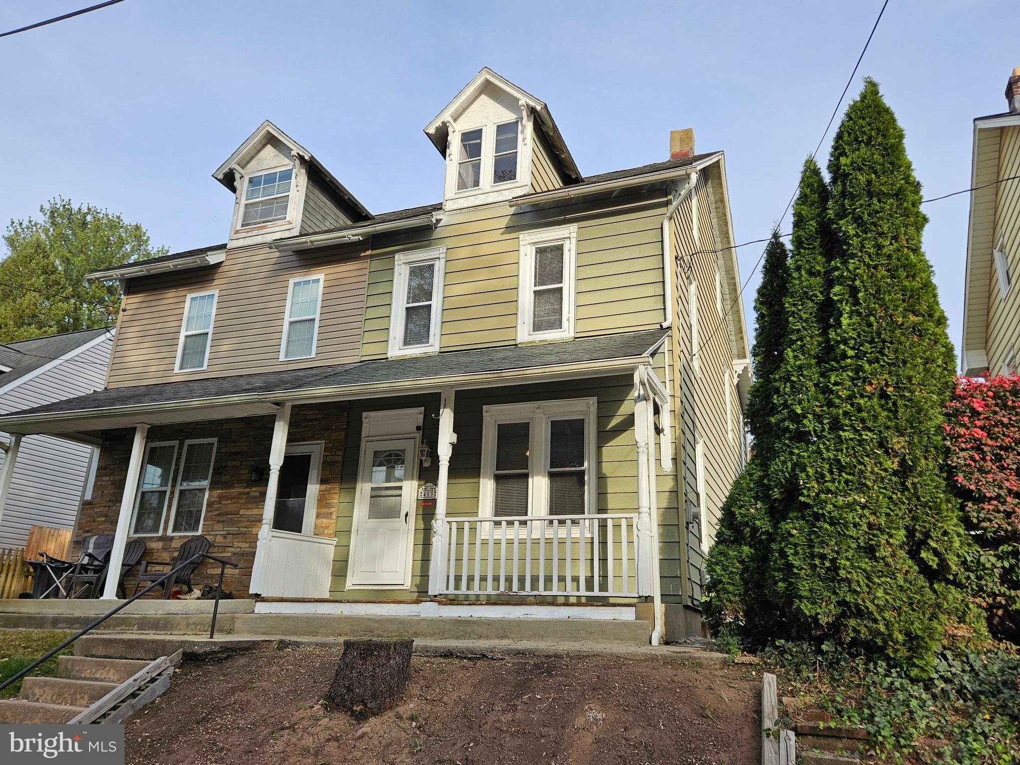 front view of a house with a garden