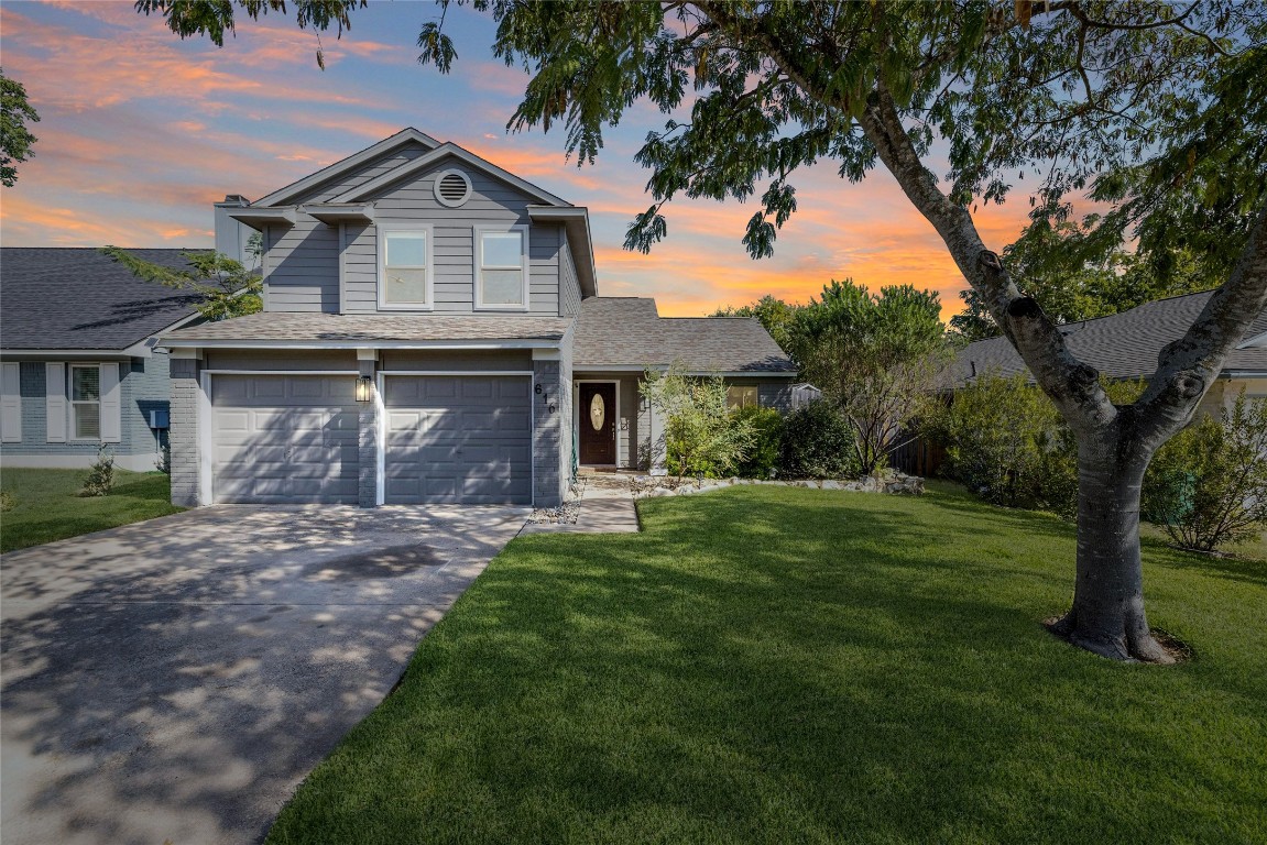 Day or night, this home truly SHINES! A stunning mature oak tree provides shade across the lush lawn.