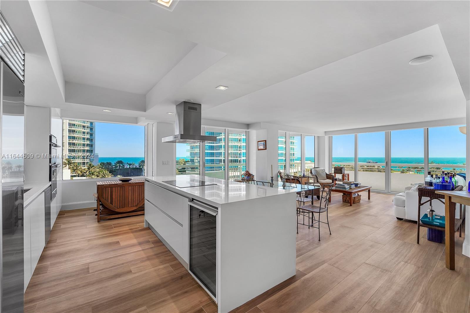 a kitchen with lots of counter top space and living room