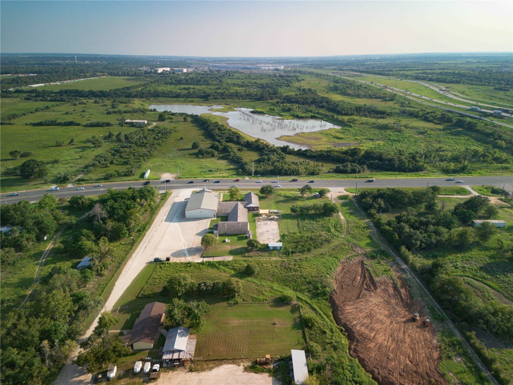 a view of a lake with a yard