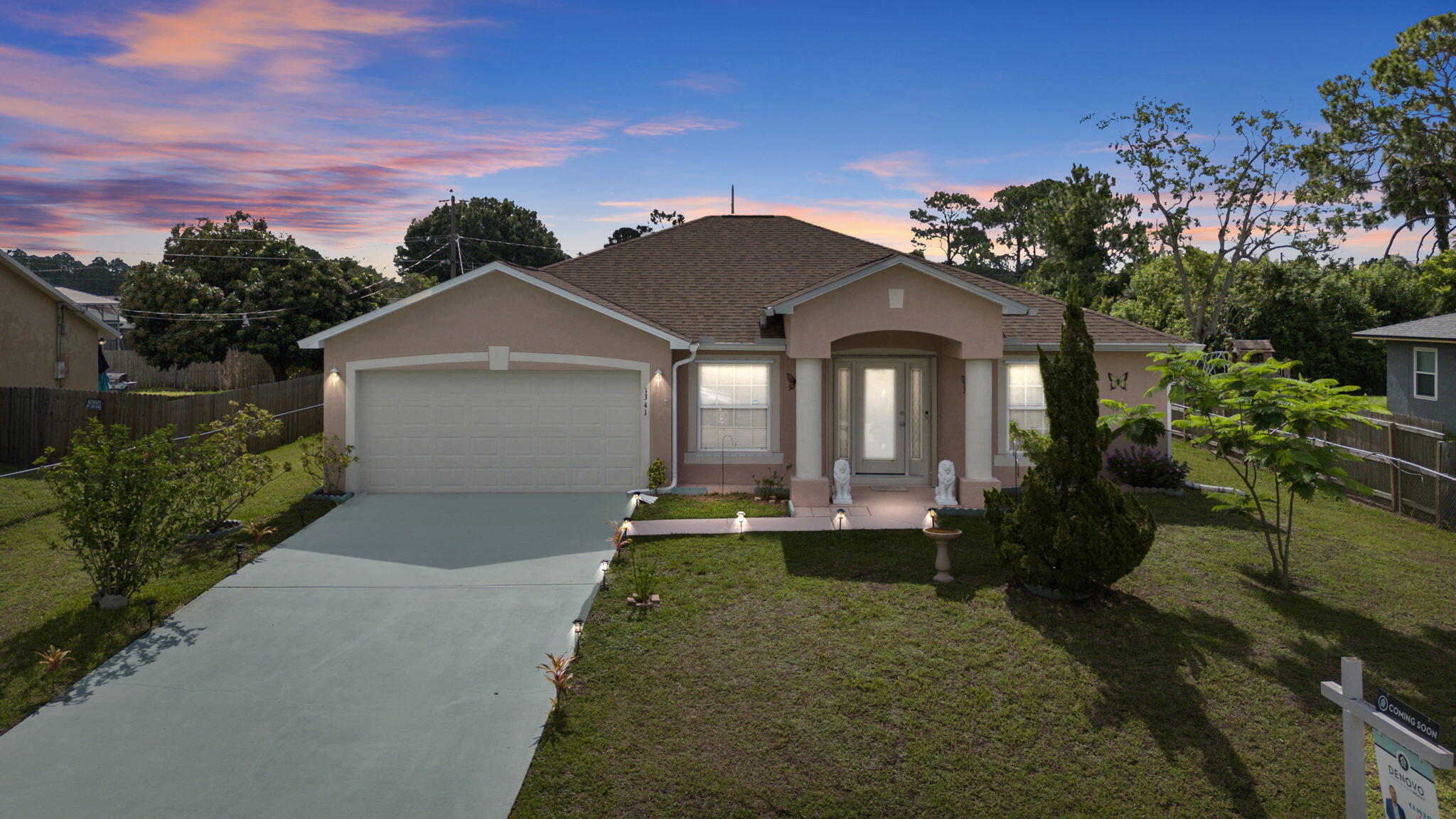 a front view of a house with a yard