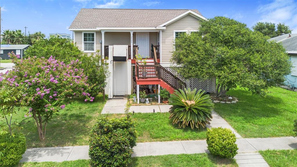 a house that has a tree in front of it