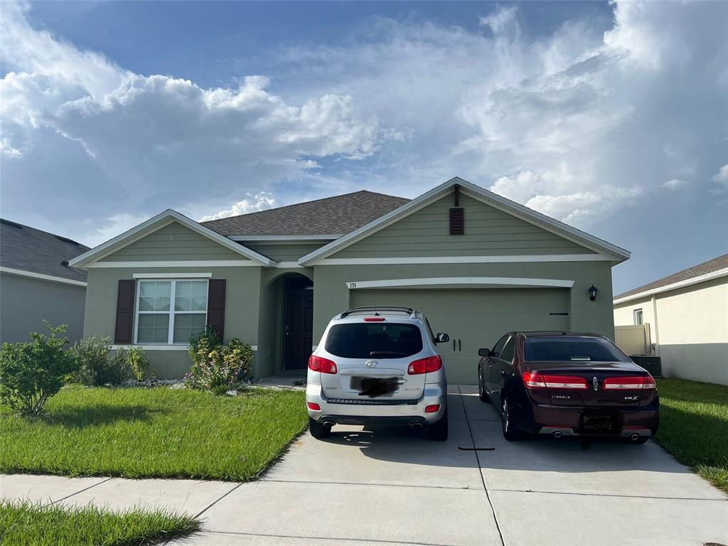 a car parked in front of a house