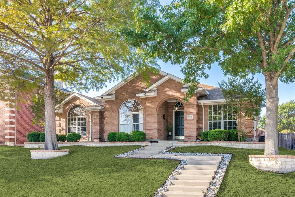 front view of a house with a yard