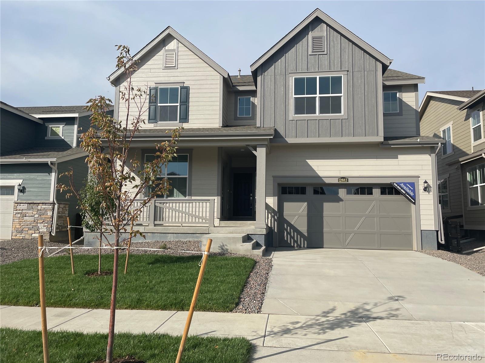 a front view of a house with a garage