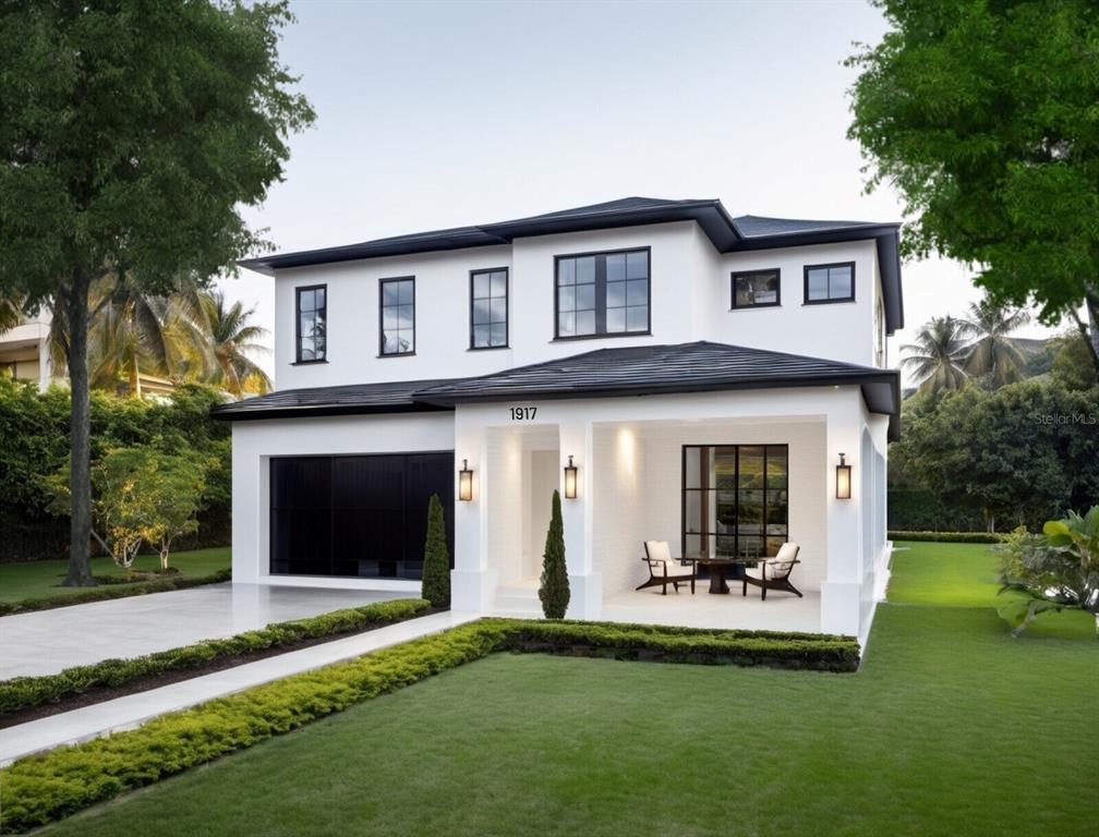 a view of a white house with a yard and a large tree