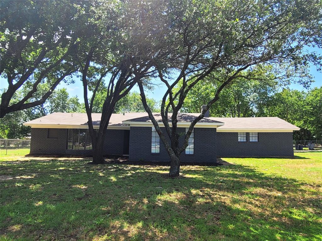 a view of a backyard with a small cabin