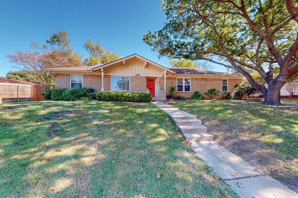 Ranch-style home featuring a front yard