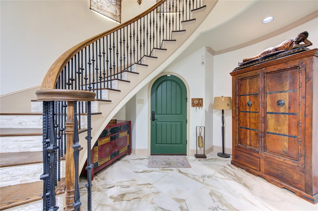 a view of staircase with wooden floor and windows