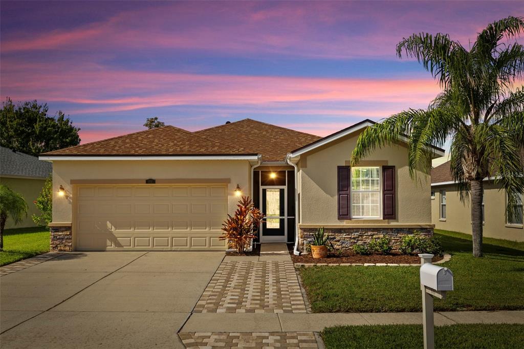 front view of a house with a yard