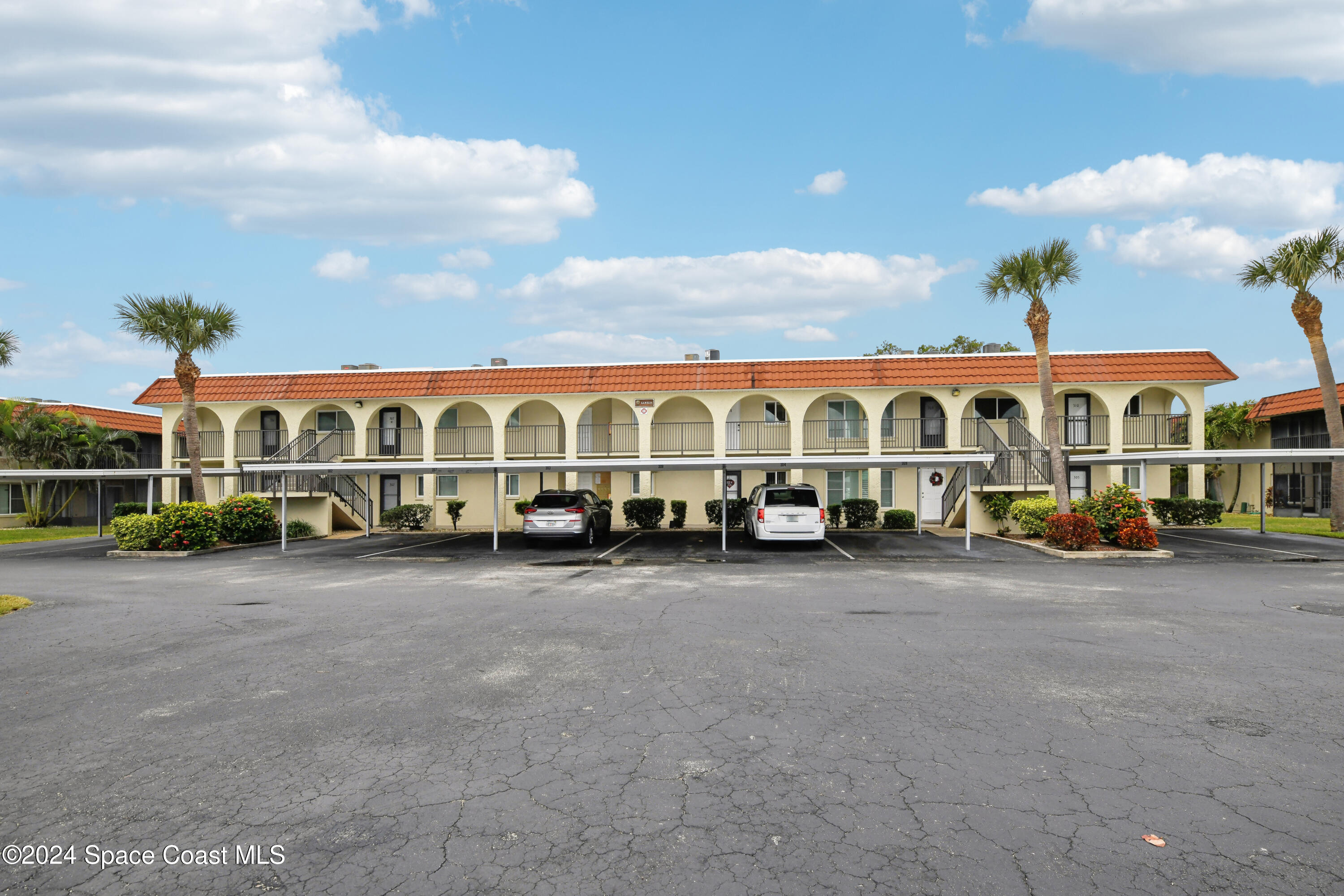 a view of a large building next to a road