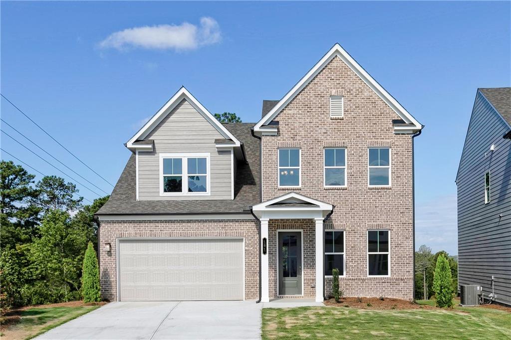 a front view of a house with a yard