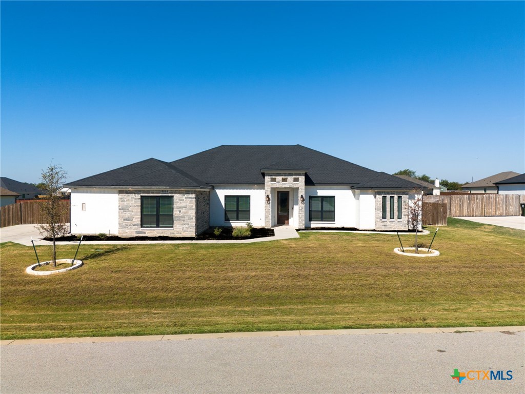 a front view of a house with swimming pool