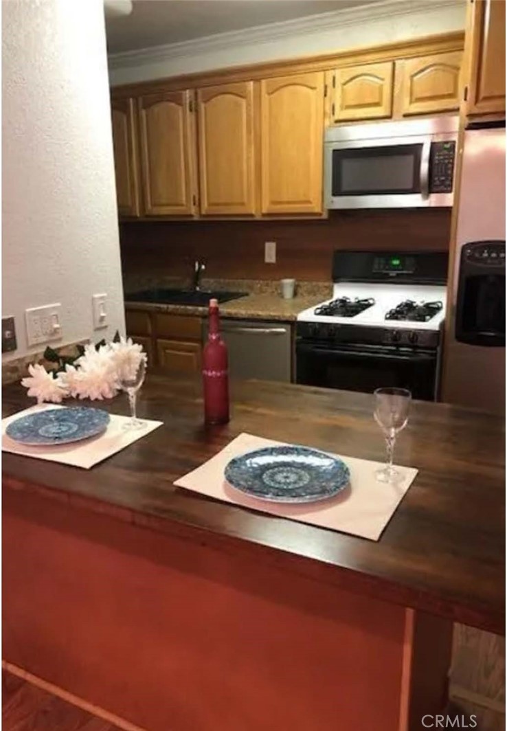 a kitchen with a stove and a microwave