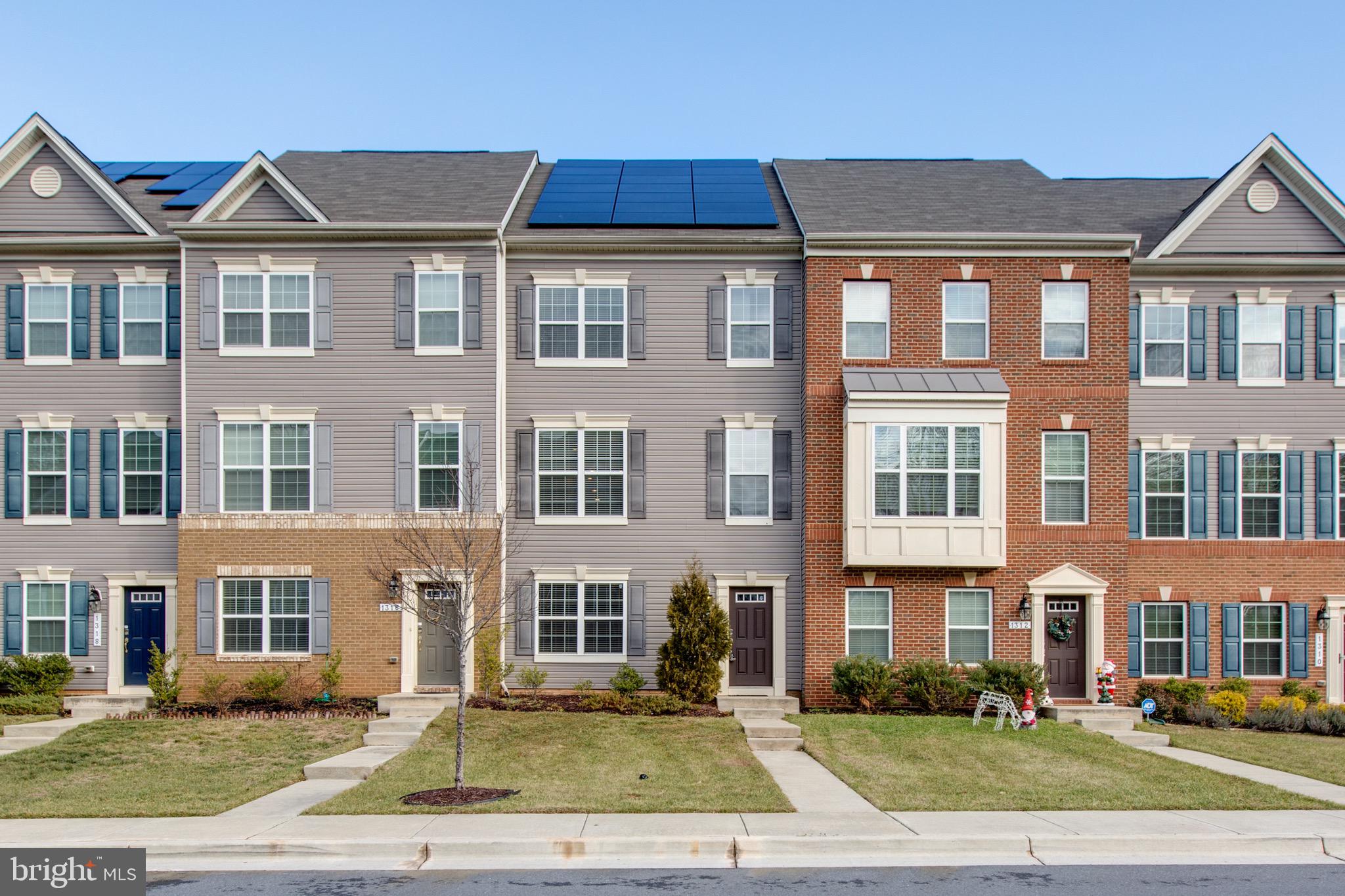 a front view of a residential apartment building with street view