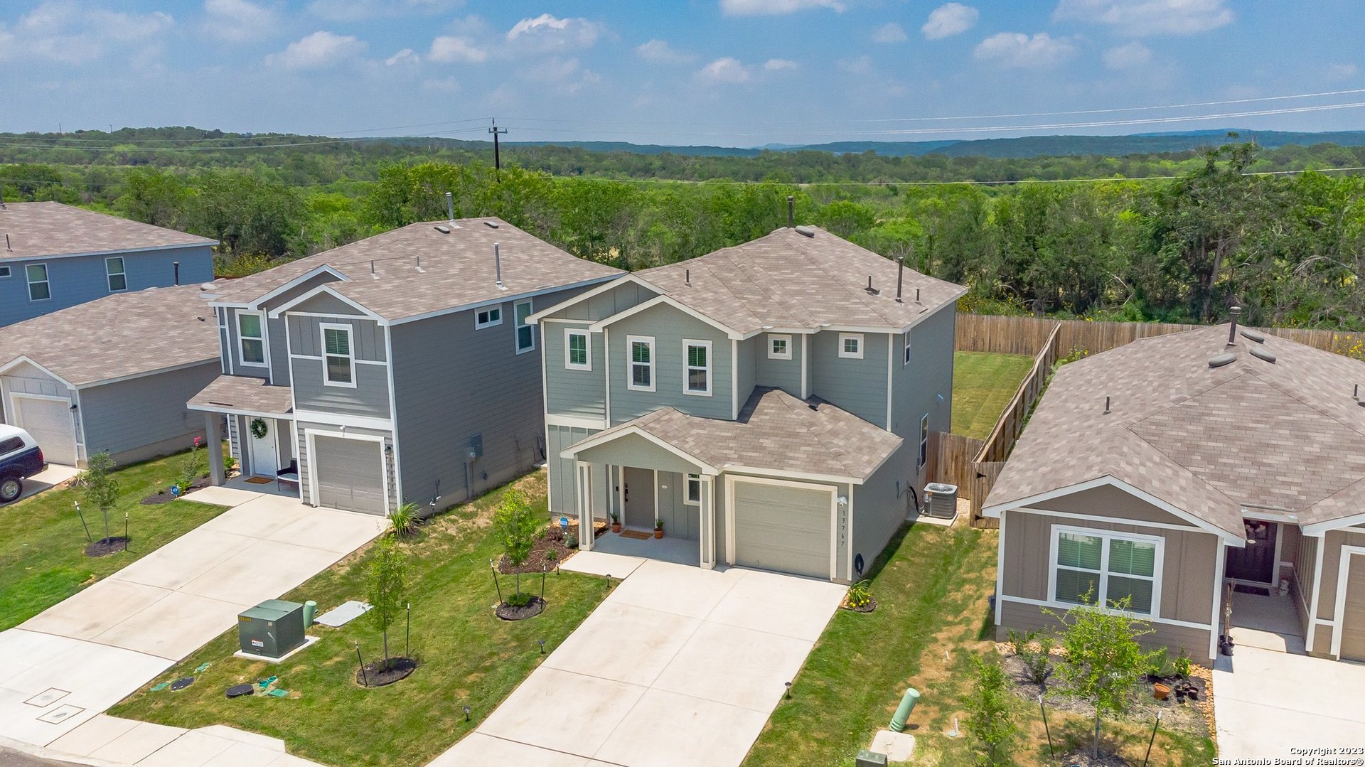 a aerial view of a house with table and chairs