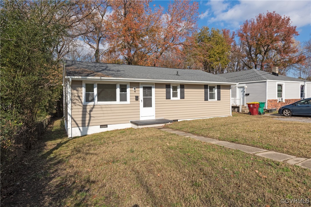 Single story home featuring a front yard