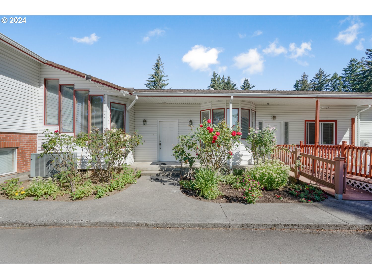 a front view of a house with garden