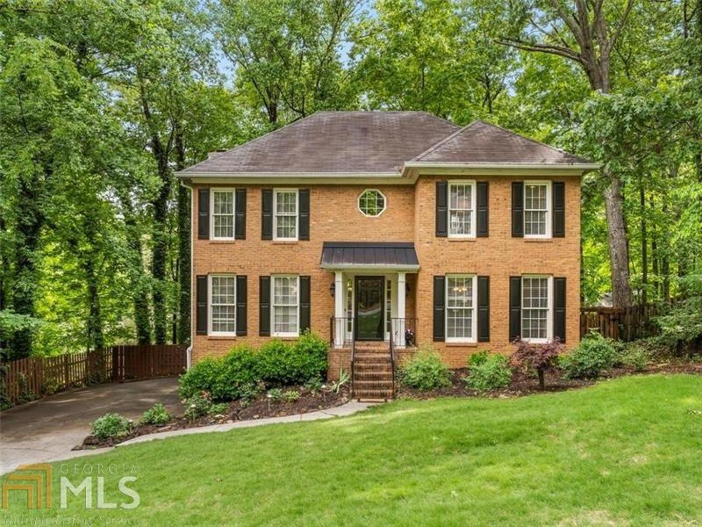 Brick front with newer front porch overhang.