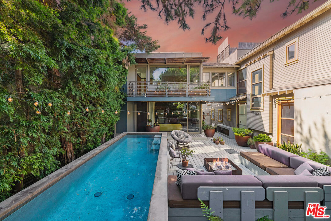 a view of house with yard outdoor seating and green space