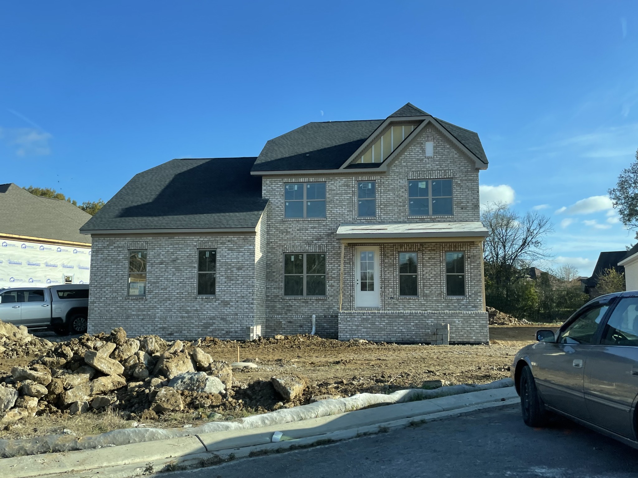 a front view of a house with a yard