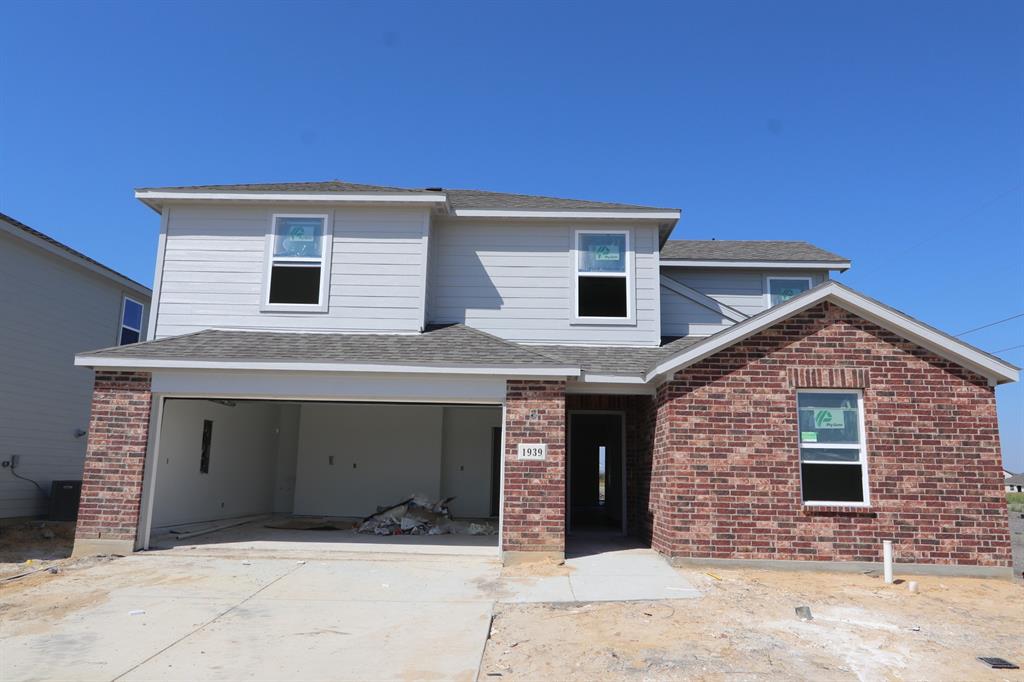 a front view of a house with a garage