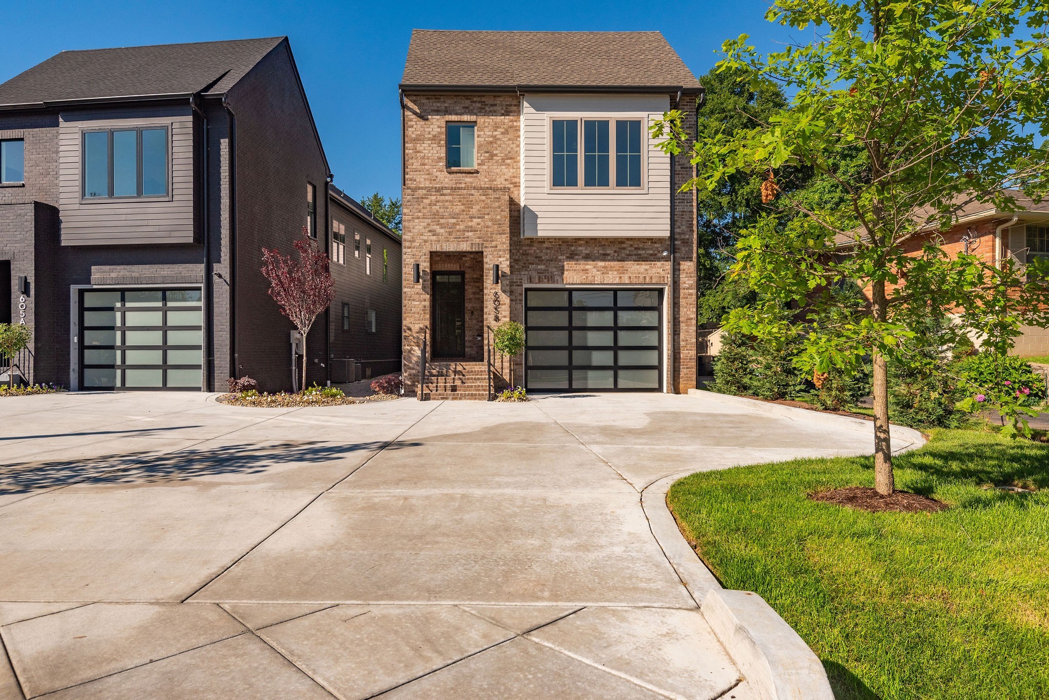 a view of a house with a backyard and a garage