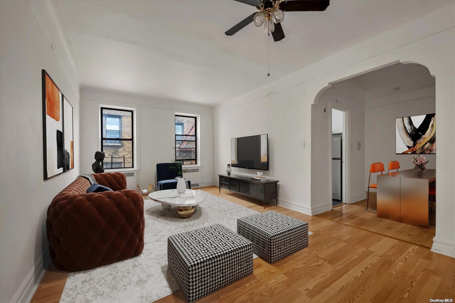 a living room with furniture and a flat screen tv